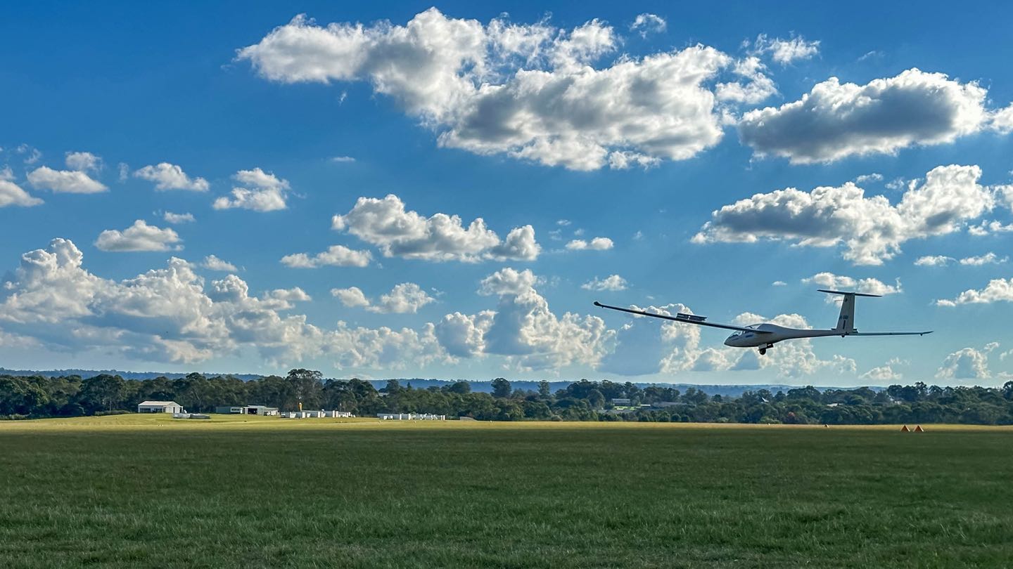 Two-seater glider VH-DGI in flight